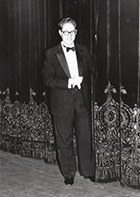 Matías in front of stage curtain